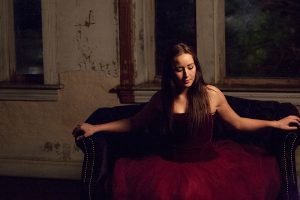 woman in tutu on couch at night