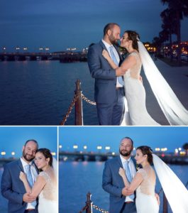 couple at night in front of the bridge of lions