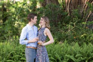 engaged couple with wine glasses