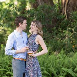 engaged couple with wine glasses