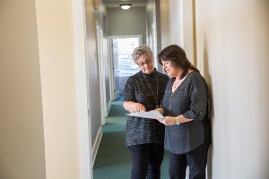 staff members in office hallway