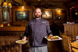 chef holding up two meals