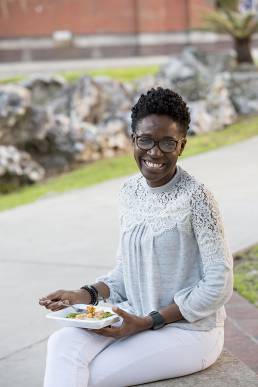 model enjoying premade meal