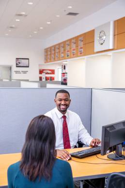 care salesman with customer in office