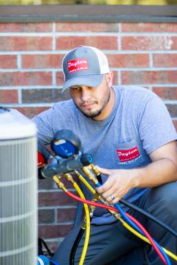 AC repair man at work