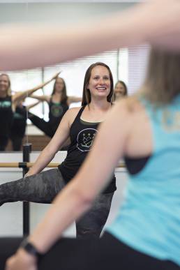 barre fitness instructor during class