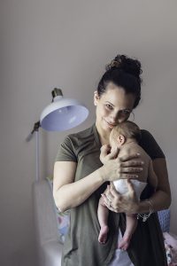 mother holding newborn